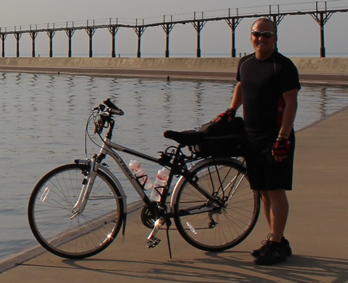 Alex next to his bike out on the Michigan City Lighthouse Pier.